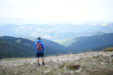 Fototapeta premium Tourist standing on Carpathian Mountains overlooking the Goverla view