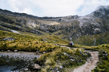 Fototapeta na wymiar Hiker on Santa Cruz Trek in Huscaran National Park in the Cordillera Blanca in Northern Peru 