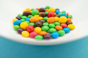 multicolored candies on a white plate