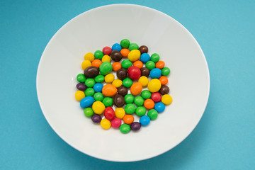 multicolored candies on a white plate