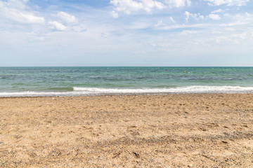 Fototapeta na wymiar Sand and waves on Beach in Bray