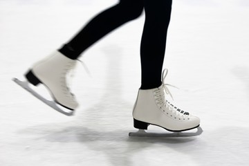 Ice Skates on Ice - obrazy, fototapety, plakaty