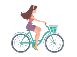 Young woman is riding a bicycle.