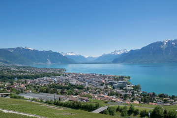 View on vineyards, Lausanne town, Lake Geneva and Alps Mountains in Switzerland