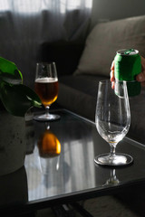 Can next to a beer glass