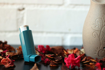 Medicine and health concept: Blue inhaler.