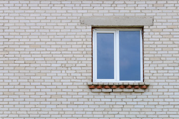 Fototapeta na wymiar Industrial white brick wall with window.