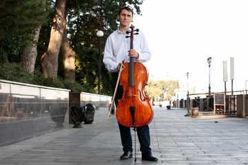 The musicians are playing cello with sunlight