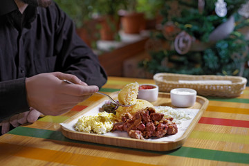 Traditional russian or moldavian or romanian or ukrainian food called mamaliga. Italian traditional Polenta, porridge made from cornmeal. Mamaliga With Cottage Cheese,meat and sour cream.