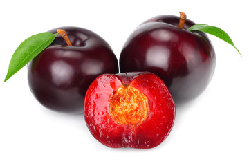 fresh plum fruit with green leaf and cut plum slices isolated on white background