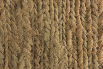 light brown natural woven beach seagrass fibers close up with natural light