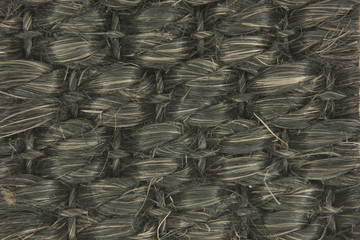 dark natural woven seagrass fibers close up texture