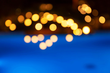 Golden lights on a black and blue background. Fuzzy. Background image.