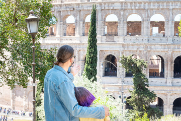 Father and dauther looking to Colloseum, Rome, Italy