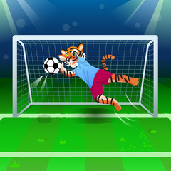 The tiger as a goalkeeper catching the soccer ball near gates on the field