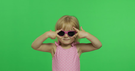 Happy, pretty child girl in pink swimsuit and sunglasses. Vacation. Chroma Key