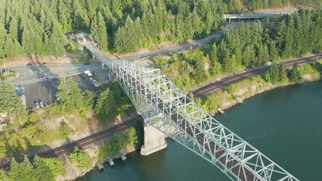 The Bridge of the Gods is a steel truss cantilever bridge that spans the Columbia River between Cascade Locks, Oregon, and Washington state near North Bonneville. 