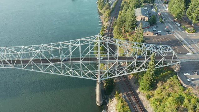 The Bridge of the Gods is a steel truss cantilever bridge that spans the Columbia River between Cascade Locks, Oregon, and Washington state near North Bonneville. 