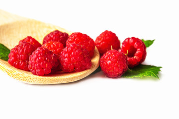 raspberries in a bowl isolated on white