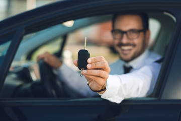 Close up of a man holding new car key