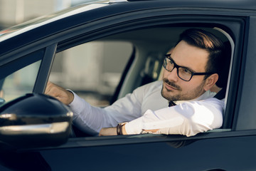 Businessman going on a business trip by car