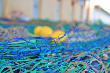 Fototapeta premium close-up view of extended fishing nets on the harbor floor