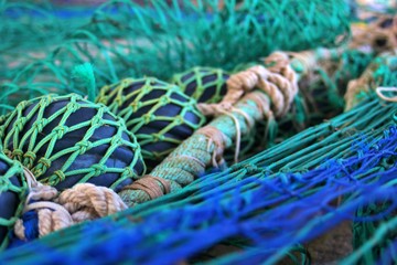 close-up view of extended fishing nets on the harbor floor