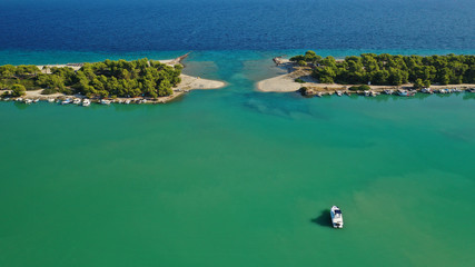 Aerial drone view of iconic sandy bay and turquoise beach of Galrokavos in Kassandra Peninsula, Halkidiki, North Greece