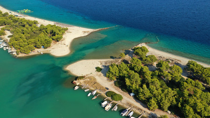 Fototapeta na wymiar Aerial drone view of iconic sandy bay and turquoise beach of Galrokavos in Kassandra Peninsula, Halkidiki, North Greece