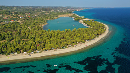 Aerial drone view of iconic sandy bay and turquoise beach of Galrokavos in Kassandra Peninsula, Halkidiki, North Greece