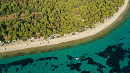 Aerial drone view of iconic sandy bay and turquoise beach of Galrokavos in Kassandra Peninsula, Halkidiki, North Greece