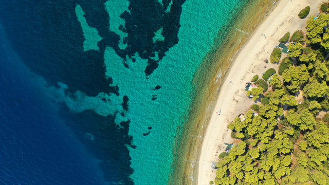 Aerial drone view of iconic sandy bay and turquoise beach of Galrokavos in Kassandra Peninsula, Halkidiki, North Greece © aerial-drone