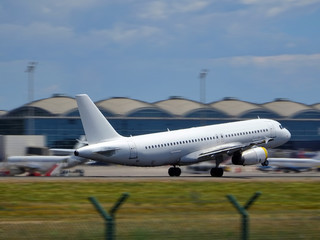 Obraz premium plane on the runway taking off from Elche Alicante airport in summer in high season