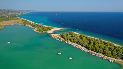 Fototapeta premium Aerial drone view of iconic sandy bay and turquoise beach of Galrokavos in Kassandra Peninsula, Halkidiki, North Greece