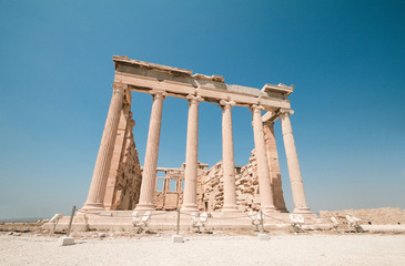 The Erechtheion is an ancient Greek temple on the north side of the Acropolis of Athens in Greece which was dedicate to both Athena and Poseidon.