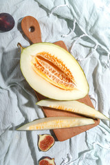 Ripe appetizing melon on a cutting board. Top view