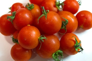 Close-up shot to a bunch of fresh cherry tomatoes