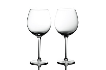 Clean Empty wine glasses with reflections on white background. Alcohol beverage card backdrop.