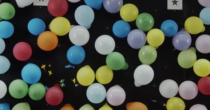 Carnival balloon dart game at fair. Shot in 4K RAW on a cinema camera.