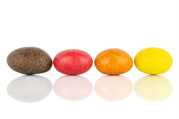 Group of four whole sugared nut dragee isolated on white background