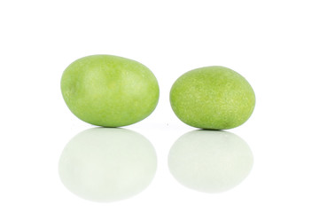 Group of two whole green sugared nut dragee isolated on white background