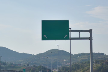 Highway and  road signs at cloudy day.