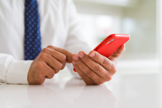 Close up of business man hands using smarpthone