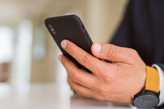 Close up of business man hands using smarpthone