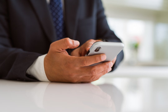 Close up of business man hands using smarpthone