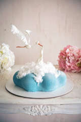 Babyshower and Newborn Cake in the form of a cloud and a stork with new baby