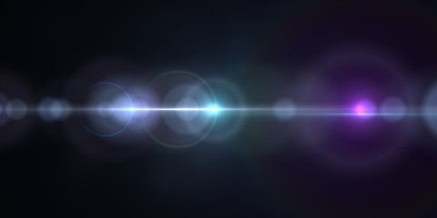 Lens flare light over black background. Easy to add overlay or screen filter over photos.