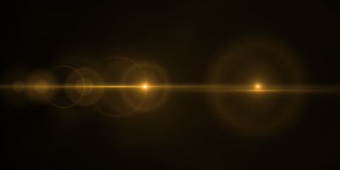 Lens flare light over black background. Easy to add overlay or screen filter over photos.