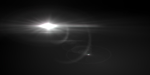 Lens flare light over black background. Easy to add overlay or screen filter over photos.