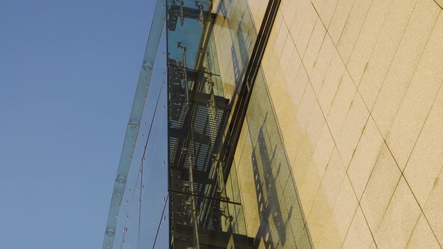 Glass Curtain Facade Wall. Fasteners Elements of Spider Glass System. Facade Detail. Architecture Abstract Background. View From Bottom to Top Tilt Up